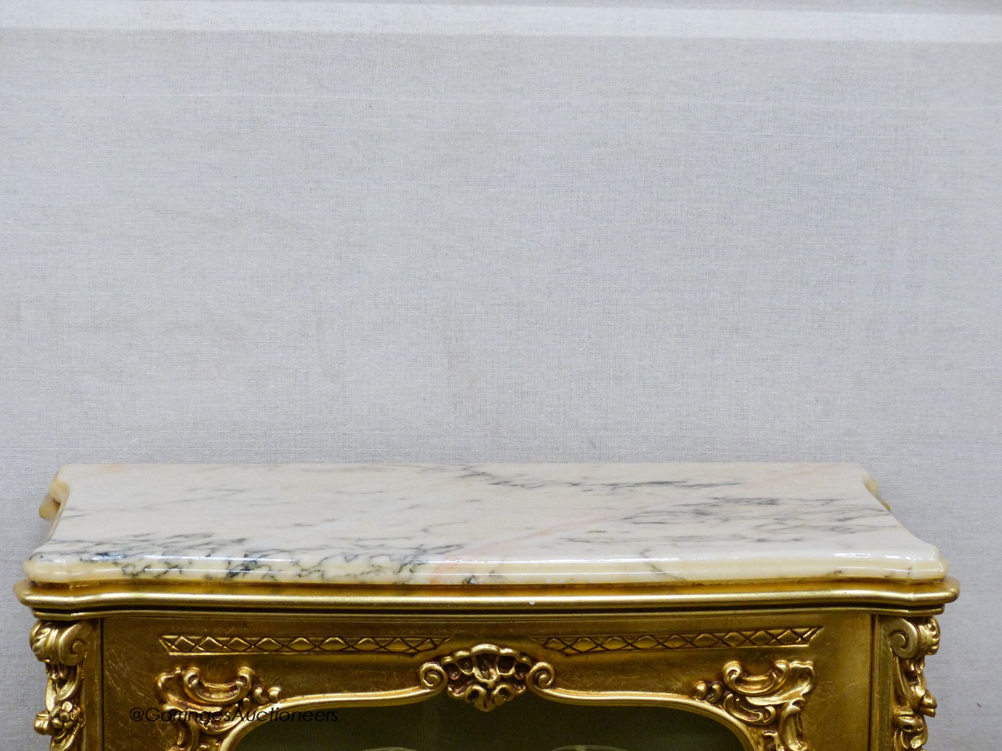 A marble topped gilt vitrine, width 73cm, depth 41cm, height 137cm